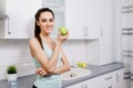 Slim Cute Brunette Girl Eating an Apple Royalty Free Stock Photo