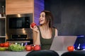 Slim Cute Brunette Girl Eating an Apple Royalty Free Stock Photo