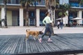 Slim Fit Girl Spending Morning Leisure For Walking Lovely Dog During Promenade At Seashore