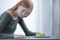 Slim girl looking at breakfast Royalty Free Stock Photo