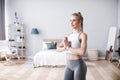 Slim girl practicing yoga at home, wellness, wellbeing