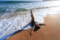 Relaxing on sand by the sea wave, summer beach concept. Royalty Free Stock Photo