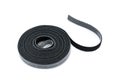 Slim hook and loop tape or velcro rools for cables on white background