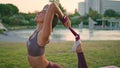 Slim lady pilates workout with resistance band at park closeup. Gymnast training Royalty Free Stock Photo