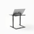 A slim laptop stand with adjustable height features, designed Royalty Free Stock Photo