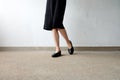 Slim Legs Woman Wear Black Shoes on Street Background Royalty Free Stock Photo