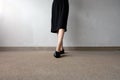 Slim Legs Woman Wear Black Shoes on Street Background Royalty Free Stock Photo
