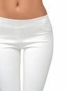 Slim legs of a young girl in leggings on a white background. Concept of a fit figure and the absence of problem areas Royalty Free Stock Photo