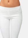 Slim legs of a young girl in leggings on a white background. Concept of a fit figure and the absence of problem areas Royalty Free Stock Photo