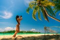 bikini girl with hat enjoy summer vacation at tropical beach. Travel and LifeStyle concept. Royalty Free Stock Photo