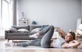 Slim sporty girl doing abs workout at home Royalty Free Stock Photo