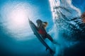 Slim surfer girl with surfboard dive underwater with under ocean wave Royalty Free Stock Photo