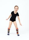 Slim teen girl doing gymnastics dance in jumping on white Royalty Free Stock Photo
