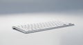 Slim, wireless computer keyboard with a minimalist design. The keyboard features a Royalty Free Stock Photo