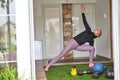 Slim women doing yoga exercise at home