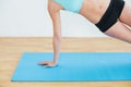 Slim woman doing the side plank yoga pose Royalty Free Stock Photo