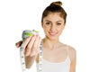 Slim woman holding apple and measuring tape Royalty Free Stock Photo