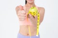 Slim woman holding apple with measuring tape Royalty Free Stock Photo