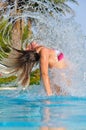 Slim woman is jumping out of pool Royalty Free Stock Photo