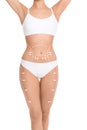 Slim woman with marks on body for cosmetic surgery operation against white background, closeup Royalty Free Stock Photo