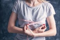 Slim woman measures her breast with a measuring tape Royalty Free Stock Photo