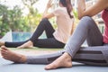 Slim woman practicing yoga near swimming pool at condo. Asian woman doing exercises in morning. balance, meditation, relaxation, Royalty Free Stock Photo