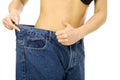 Slim woman wearing too big pants Royalty Free Stock Photo