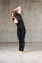 Slim young dancer posing in studio. Royalty Free Stock Photo