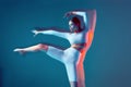 Slim young girl dancing contemporary ballet dance. Motion blur, long exposure. Ballerina perform freestyle movements Royalty Free Stock Photo