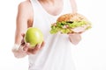 Slim young man making choice in eating Royalty Free Stock Photo