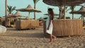 Slim young woman enjoying summer seashore. Long hair girl walking at beach. Royalty Free Stock Photo