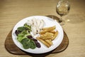 Slimmer`s chicken meal with salad, fries and wine. Royalty Free Stock Photo