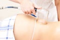 Slimming procedure. Vacuum massage. Girl patient. Modern medicine Royalty Free Stock Photo