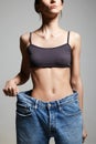 slimming Young woman in jeans. Beautiful body Thin Girl