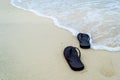 Slippers on beach Royalty Free Stock Photo