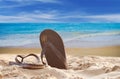 Slippers on the beautiful sandy beach, holiday concept Royalty Free Stock Photo