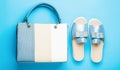 Slippers on a blue background. Slippers for the summer. Ladies bag and stylish blue shoes. Stylish blue women's leather Royalty Free Stock Photo