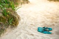 Slippers on the sandy beach Royalty Free Stock Photo