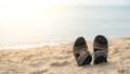 Slippers on the Sandy Beach Vacation Time Royalty Free Stock Photo
