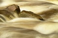 Slippery boulders in mountain stream. Clear water blurred by long exposure, low water level. Royalty Free Stock Photo