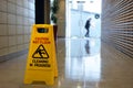 Slippery floor surface warning sign and symbol on a wet floor Royalty Free Stock Photo