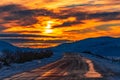 Slippery road in mountainous area at dawn time Royalty Free Stock Photo