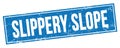 SLIPPERY SLOPE text on blue grungy rectangle stamp