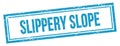 SLIPPERY SLOPE text on blue grungy vintage stamp