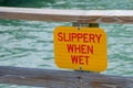 SLIPPERY WHEN WET dock sign Royalty Free Stock Photo