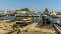 A slipway with fishermen`s boats against a background of Isole dei Ciclopi at Aci Trezza, Sicily