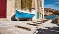 A slipway to a cove in a Mediterranean fishing village, with wooden blocks on the floor for the boats