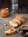 Slised sweet braided bread loaf . ÃÂ¡hallah, coffee and jam, concept holliday brackfast. Closeup, shallow depth of field