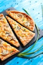 Slised vegeterian home made pizza mushrooms on blue table Royalty Free Stock Photo