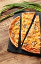 Slised vegeterian home made pizza with mushrooms. Top view on wooden table Royalty Free Stock Photo